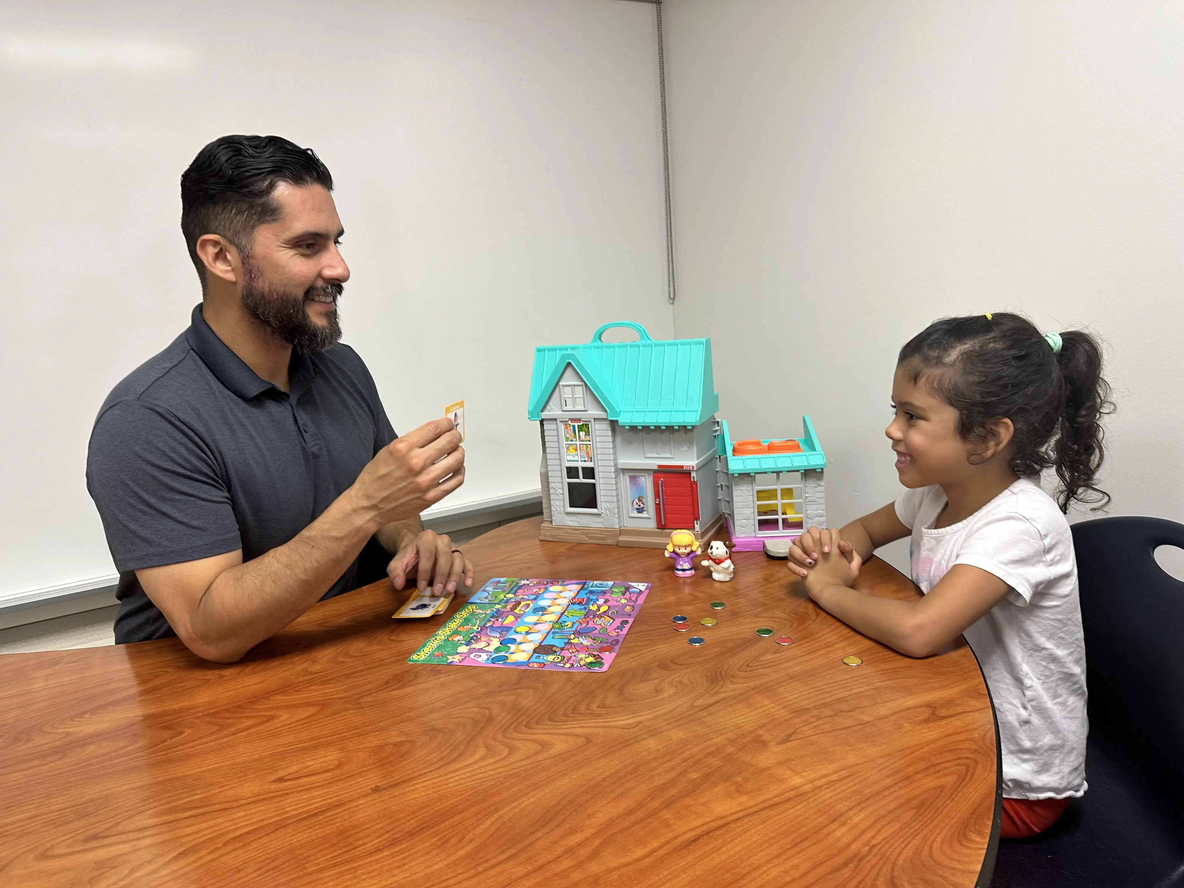 Zef Tirado conducting speech therapy session with a child